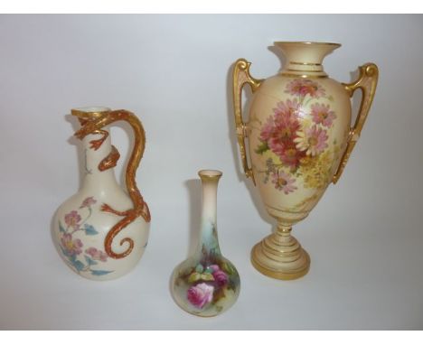 A Royal Worcester ivory ground ewer with painted and gilded floral decoration and handle in the form of a writhing serpent wi