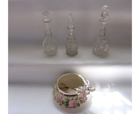 Three clear cut glass decanters to include an example with extensive cut detail and elaborate deceptive stopper together with