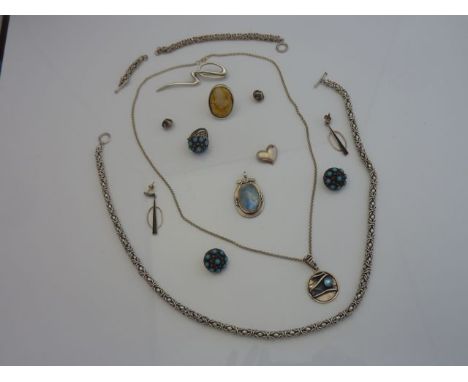 An Egyptian silver demi-parure, comprising: a pair of earrings and a ring, set with turquoise; a sterling silver necklace and