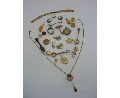 A gold-plated pendant necklace, set with two ruby coloured paste stones; a gold-plated insect brooch, with enamelled details;