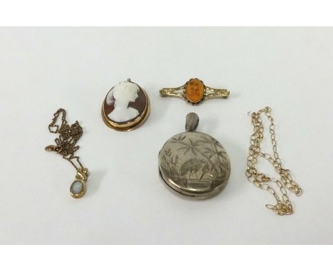 A cameo brooch set in yellow metal, a silver locket, an opal pendant necklace, fine gold chain and a 9ct brooch.