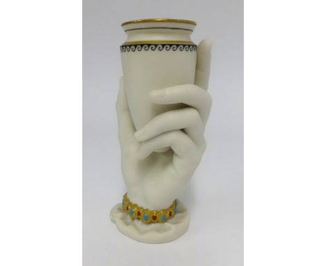 A Worcester unglazed porcelain vase and modelled in the form of a hand and urn, height 16cm.