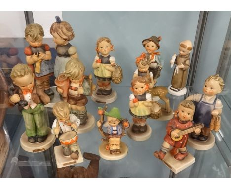 A collection of Goebel Hummel figures including large group 'Knitting Lesson' approx 19cm with several other 13cm figures and