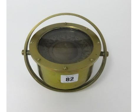 A small brass binnacle compass.