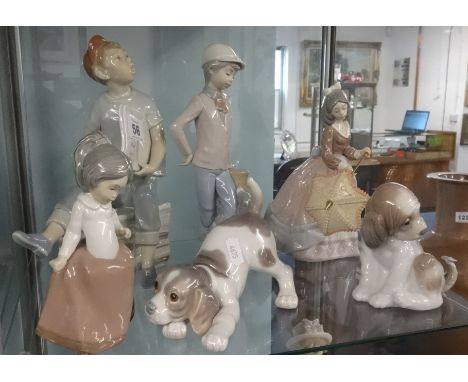 A collection of three Nao figures and three Lladro figures including two dogs (6).