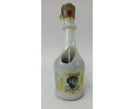 A Salvador Dali design pottery decanter Brandy Conde de Osborne, 75cl, wax sealed, 29cm high.