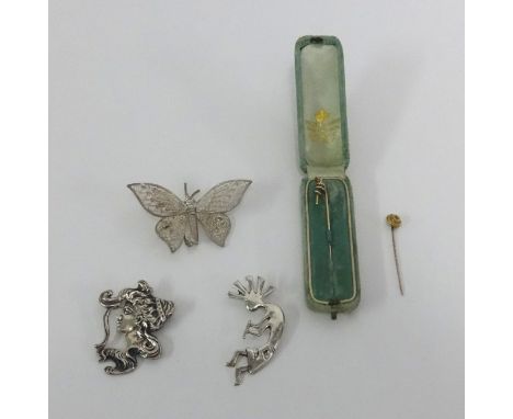 Two antique tie pins, art nouveau white metal brooch and two others.