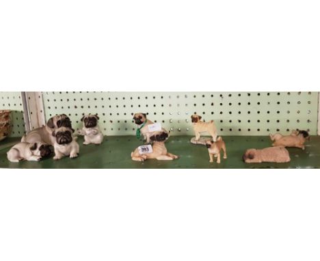 SHELF OF PUG DOG ORNAMENTS 