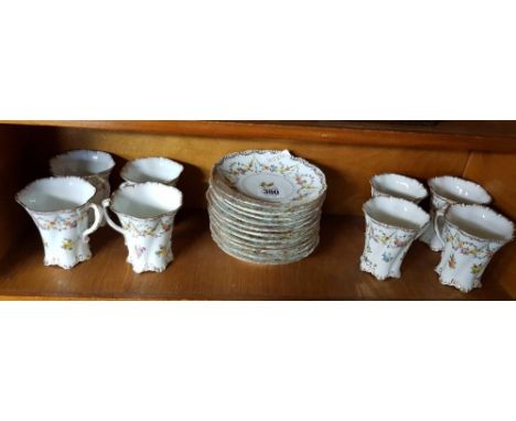 SHELF OF DECORATIVE CUPS & SAUCERS BY DRESDEN