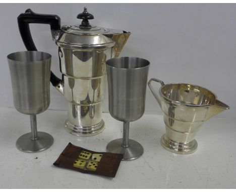 An Art Deco teapot, jug, two goblets and pocket dominoes 