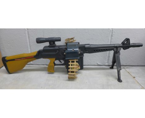 A 1st Marxman toy machine gun with ammunition cassette 