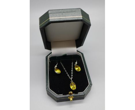 A vintage silver and stone set pendant and chain with earrings, (test as silver) 