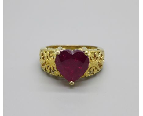A silver gilt, heart shape ruby solitaire ring, P 