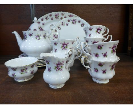 A Royal Albert Sweet Violet six setting tea set with teapot, cream and sugar, cake plate and oval plate 