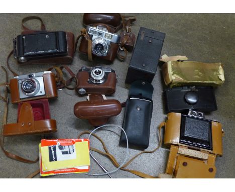 A collection of vintage cameras, including folding, Halina, Voigtlander and Agfa 