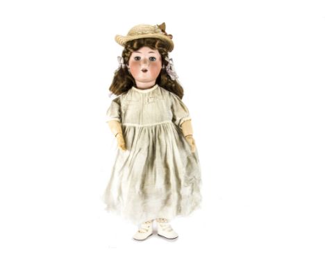 A Heinrich Handwerck child doll, with blue lashed sleeping eyes, brown synthetic wig, jointed composition body, white cotton 