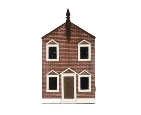 A late 19th century carpenter built dolls’ house, a box back type with brick painted façade, central finial, four windows and