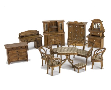 Oak dolls’ house furniture: a wardrobe with E. Barbet Fancy and Toy Repository, ? High Street shop label -5½in. (14cm.) high,