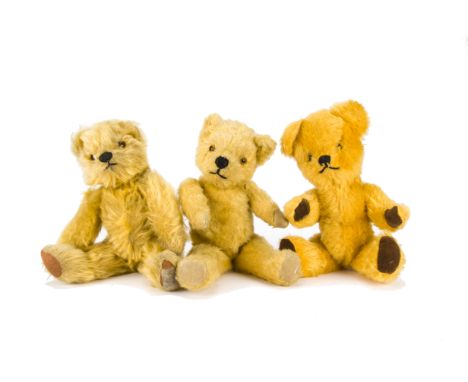 Three post-war British teddy bears: a Chad Valley with dark blonde mohair, orange and black glass eyes, swivel head, jointed 