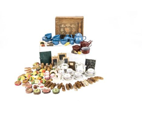 Doll’s food and accessories: an early wooden doll’s tea set box with paper illustrated label; a Continental doll’s tea set (s