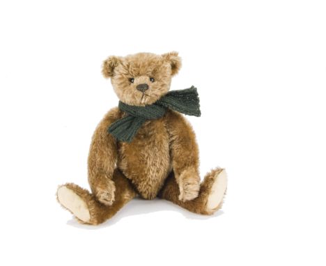A fine early Steiff teddy bear, with cinnamon/brown mohair, black boot button eyes, pronounced clipped muzzle, black stitched