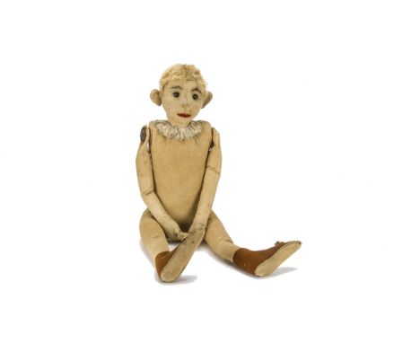 An early Steiff clown circa 1904, with felt face, hands and feet, black boot button eyes, blonde mohair wig, jointed cloth bo