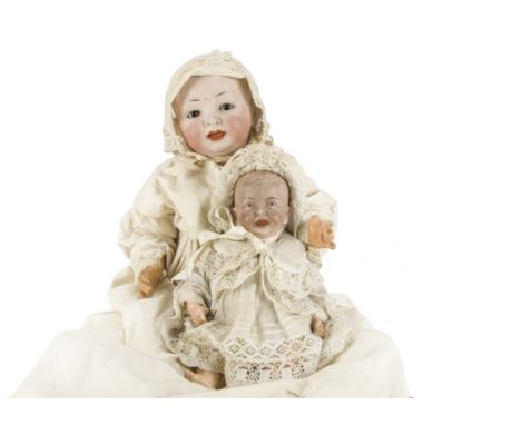 Two German character babies: one Hertel Schwab marked 151 with brown sleeping eyes, open/closed mouth with moulded tongue and