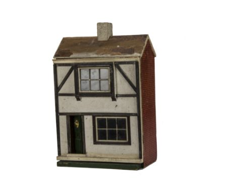 A small Lines 1920s dolls’ house, with front door with lion mask, half-timbered pebble-dashed façade, two large tinplate wind