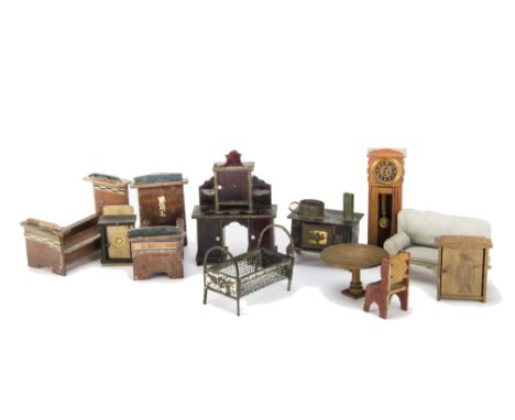 German dolls’ house furniture: a tinplate bed with angel motif at each end -4in. (10cm.) long, an upholstered sofa, a dark st