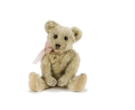 A rare Joseph Pittmann (Jopi) musical teddy bear 1930s, with cream alpaca plush, large brown and black glass eyes with large 