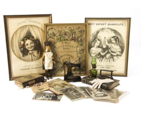 Various items: three framed song sheets, a toy sewing machine, dolly related postcards, a child’s flat iron; and a modern Nut