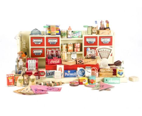 A German toy grocery shop, 1950s, painted cream wood with red drawers an counter, scales and cash register and a quantity of 