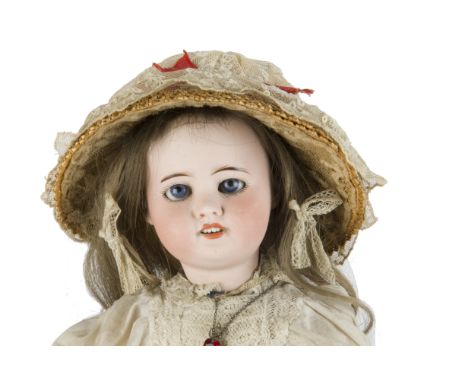A S.F.B.J. 60 child doll, with blue sleeping eyes, blonde hair wig, jointed papier-mâché body, white muslin dress, undercloth