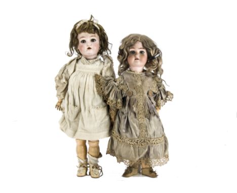 Two Simon & Halbig bisque headed child dolls: both in period clothes, one for Kämmer & Reinhardt with jointed composition bod