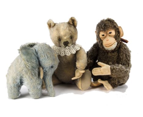 A Steiff Jocko monkey 1930s, with felt face, ears, hands and feet, brown mohair, swivel head and jointed limbs -12½in. (32cm.