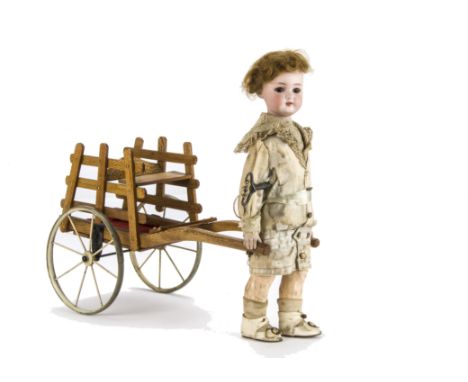 A rare Roulet & Decamps automaton of a boy with cart, with Simon & Halbig 1078 bisque head, fixed brown lashed eyes, composit