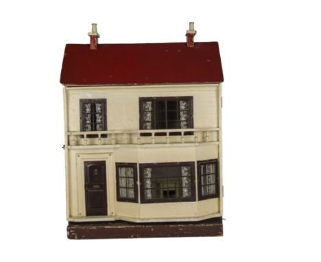 A G & J Lines dolls’ house circa 1915, cream painted with lithographed tinplate front door with knocker and letter box, groun