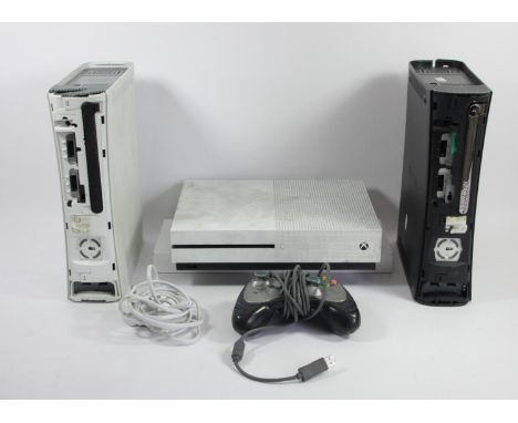 An Xbox One S console, 500gb, white, with power cable, together with two Xbox 360 consoles, white and black, also including a