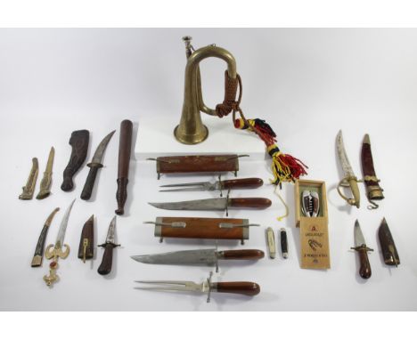 A collection of decorative knives and daggers to include Indian carved wood knife and fork sets, Kindjal daggers with Sheaths