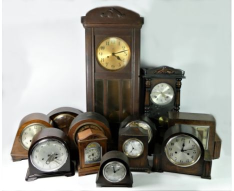 A large German made wall clock, mahogany cased, glazed front, painted dial, together with a collection of mantle, carraige an