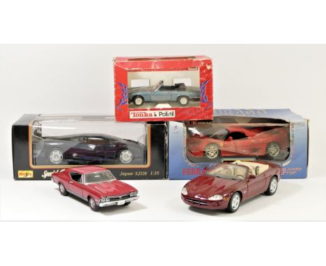 A collection of five scale model of cars, including a Burago Ferrari F50, boxed, a Tonka Jaguar XJS, boxed, a Maisto Jaguar X