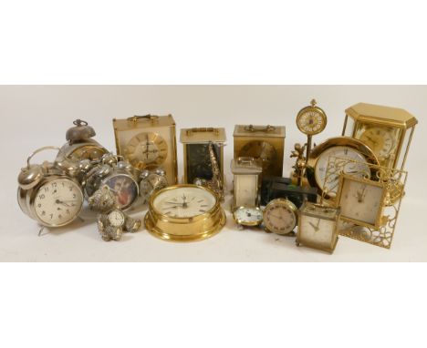 A collection of mantle, carriage, alarm and novelty clocks to include a boxed Winnie the Pooh novelty clock, a replica ships 