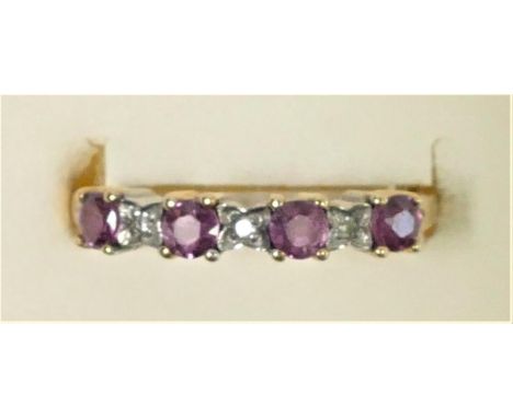 A 9ct gold ruby and diamond dress ring, M 1/2, 1.5gm. 