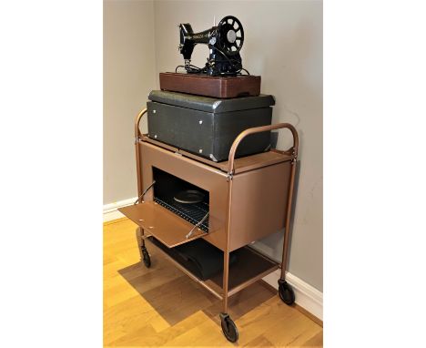 A Singer 2-7-12 sewing machine, converted to electric with built in light, Singer branded matt and carry case, together with 