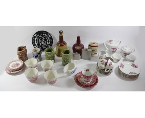 A large collection of homewares, to include ceramic spirit decanters, part dinner/tea services, storage jars, Wedgwood plates