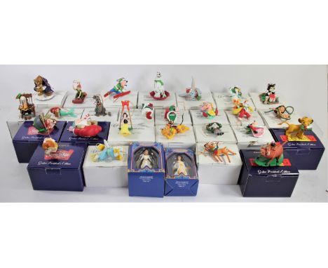 A collection of twenty eight Grolier Disney Christmas decorations, boxed, including Figaro (127), Scrooge (213), Donald (203)