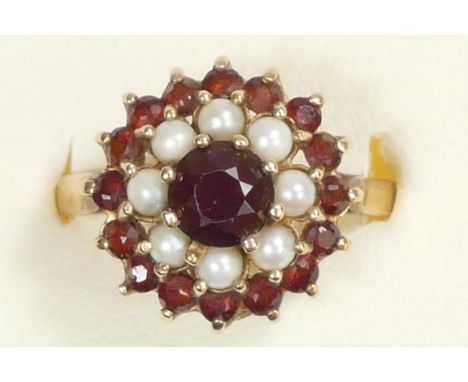 A 9ct gold garnet and pearl cluster ring, R 1/2, setting damaged, 3gm 