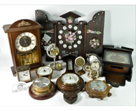 A 19th century brass aneroid barometer with thermometer, together with a collection of wall, mantle, carriage and novelty clo