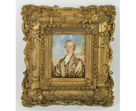 An early 19th century portrait miniature on ivorine of a gentleman, ornate gilt wood frame, 22 x 25cm overall 