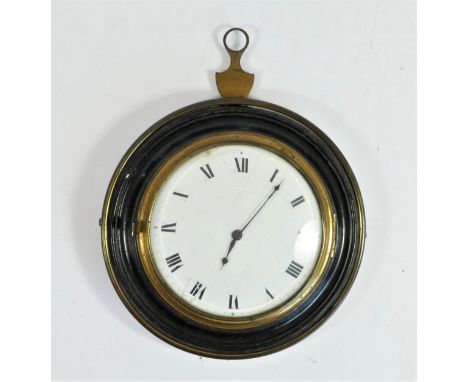 A wall hanging circular clock, stained oak case, housed in a brass ring, hinged glazed door opens to reveal an enamel dial, p